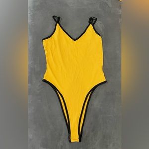 Yellow high cut bodysuit. Adjustable straps. Size S. SHEIN.